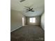 Neutral bedroom featuring carpet, a vaulted ceiling, and a ceiling fan at 14331 Evening Flight Ln, Charlotte, NC 28262