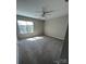 Spacious carpeted bedroom with large window, offering plenty of natural light at 14331 Evening Flight Ln, Charlotte, NC 28262
