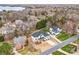 Aerial view of residential neighborhood with mature trees, well-manicured lawns, and waterfront access at 15818 Sparrowridge Ct, Charlotte, NC 28278