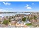Aerial view of waterfront community with lake views and luxury homes on manicured lots at 15818 Sparrowridge Ct, Charlotte, NC 28278