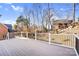Spacious back deck with wooded views and wrought iron railing, ideal for outdoor entertaining at 15818 Sparrowridge Ct, Charlotte, NC 28278