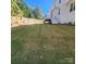Lush, green backyard with a bright sun and a charming deck, perfect for outdoor enjoyment at 15818 Sparrowridge Ct, Charlotte, NC 28278
