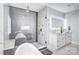 Beautiful bathroom featuring a glass shower and a dual sink vanity with lighted mirror at 15818 Sparrowridge Ct, Charlotte, NC 28278