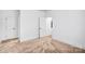 Simple bedroom with carpet, white walls and trim, and two doors at 15818 Sparrowridge Ct, Charlotte, NC 28278