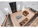 Open-concept living room features a fireplace, stylish furniture, and ample natural light, perfect for comfortable living at 15818 Sparrowridge Ct, Charlotte, NC 28278