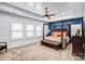Spacious main bedroom featuring a four-poster bed, complemented by white shutters and tasteful decor at 15818 Sparrowridge Ct, Charlotte, NC 28278