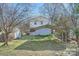 A view of the backyard with a metal carport and small storage shed at 1607 Harrill St, Charlotte, NC 28205