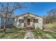Charming single-story home featuring a covered entryway, siding, and a well-maintained front yard at 1607 Harrill St, Charlotte, NC 28205