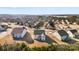 Aerial view of a home in a neighborhood with a lake in the distance at 16617 Cozy Cove Rd, Charlotte, NC 28278