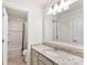 Clean and well-lit bathroom featuring a shower/tub combo and granite countertops at 16617 Cozy Cove Rd, Charlotte, NC 28278