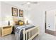 Cozy bedroom with neutral carpet, a full-size bed, and bright yellow bedside lamps at 16617 Cozy Cove Rd, Charlotte, NC 28278