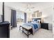 Bright bedroom featuring a queen bed, neutral decor, and a window with neighborhood views at 16617 Cozy Cove Rd, Charlotte, NC 28278