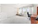 Bright bonus room featuring carpeted floors and a desk with a comfortable office chair at 16617 Cozy Cove Rd, Charlotte, NC 28278
