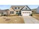 Charming home with a combination of brick and siding, complemented by a well-manicured front yard at 16617 Cozy Cove Rd, Charlotte, NC 28278