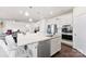 Kitchen with a large island featuring bar seating and modern stainless steel appliances at 16617 Cozy Cove Rd, Charlotte, NC 28278