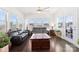 Bright sunroom with large windows offering ample natural light and comfortable seating at 16617 Cozy Cove Rd, Charlotte, NC 28278
