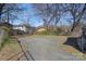 Large backyard with gravel ground, a fence border, and potential for customization at 1714 S Tryon St, Charlotte, NC 28203