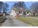Charming home with a welcoming front porch, brick accents, and a well-maintained lawn at 1714 S Tryon St, Charlotte, NC 28203