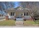 Charming bungalow with front porch and stone accents, showcasing its curb appeal at 1714 S Tryon St, Charlotte, NC 28203