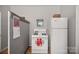 Functional kitchen with white appliances, a gas range, and sufficient storage space at 1714 S Tryon St, Charlotte, NC 28203