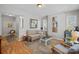 Cozy living room featuring neutral decor, hardwood floors, and plenty of natural light at 1714 S Tryon St, Charlotte, NC 28203