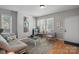 Bright and airy living room with hardwood floors, comfortable seating, and natural light at 1714 S Tryon St, Charlotte, NC 28203