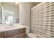 Compact bathroom featuring a vanity with storage, a toilet, and a shower with curtain at 182 Walking Horse Trl, Davidson, NC 28036