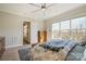 Comfortable bedroom with a ceiling fan, large window with a view, and an ensuite bathroom at 182 Walking Horse Trl, Davidson, NC 28036