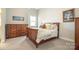 Relaxing bedroom with wooden furniture, soft lighting, and plush carpeting at 182 Walking Horse Trl, Davidson, NC 28036