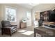 Bright home office with large windows, a built-in bookcase, and comfortable furnishings at 182 Walking Horse Trl, Davidson, NC 28036
