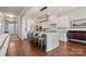 Open-concept kitchen featuring a spacious island with bar seating, modern appliances, and stylish cabinetry at 182 Walking Horse Trl, Davidson, NC 28036