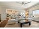 Spacious living room with a large sectional sofa, modern lighting, and open access to the gourmet kitchen at 182 Walking Horse Trl, Davidson, NC 28036