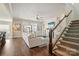 Inviting living room with hardwood floors, a cozy fireplace, and an abundance of natural light from the large windows at 182 Walking Horse Trl, Davidson, NC 28036
