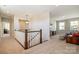 Spacious loft area with a comfortable seating area and a view of the outdoors at 182 Walking Horse Trl, Davidson, NC 28036