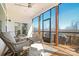 Relaxing screened porch with comfortable seating and wooded views, perfect for enjoying the outdoors at 182 Walking Horse Trl, Davidson, NC 28036