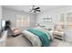 Cozy bedroom featuring soothing decor, two windows with white shutters, and neutral carpet at 2020 Canova Dr, Mount Holly, NC 28210