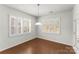 Dining Room features plantation shutters, hardwood floors, and natural light at 2020 Canova Dr, Mount Holly, NC 28210