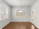Dining room features plantation shutters, hardwood floors, and glass door entry to backyard at 2020 Canova Dr, Mount Holly, NC 28210
