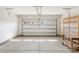Clean two-car garage with high ceilings, shelving and plenty of storage at 2020 Canova Dr, Mount Holly, NC 28210