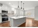 Modern kitchen featuring a large island, stainless steel appliances, and ample counter space at 2020 Canova Dr, Mount Holly, NC 28210