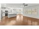 Spacious kitchen with stainless steel appliances, white cabinets, and hardwood floors at 2020 Canova Dr, Mount Holly, NC 28210