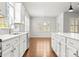 Bright eat-in kitchen area with new stainless steel appliances, white cabinetry, and plenty of natural light at 2020 Canova Dr, Mount Holly, NC 28210