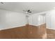 Hardwood floors flow throughout the living room and into the hall and doorways at 2020 Canova Dr, Mount Holly, NC 28210