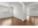 Bright living room with hardwood flooring, ceiling fan, and plenty of natural light at 2020 Canova Dr, Mount Holly, NC 28210