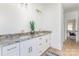 Bathroom vanity featuring granite countertops, double sinks, gold hardware, and white cabinets at 2095 Tite Rd, Stanfield, NC 28163