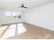 Bright, spacious room featuring hardwood flooring and a well-lit interior with large windows at 2095 Tite Rd, Stanfield, NC 28163
