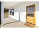 Inviting front porch with wood door, a window, and a welcome mat that reads, 