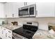 Updated kitchen featuring stainless steel appliances and granite countertops at 2095 Tite Rd, Stanfield, NC 28163