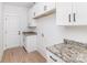 Convenient laundry room with granite countertops and cabinetry at 2095 Tite Rd, Stanfield, NC 28163