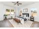Light-filled main bedroom with a ceiling fan and modern decor at 2095 Tite Rd, Stanfield, NC 28163